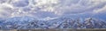 Winter Panorama of Oquirrh Mountain range snow capped, which includes The Bingham Canyon Mine or Kennecott Copper Mine, rumored th