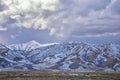 Winter Panorama of Oquirrh Mountain range snow capped, which includes The Bingham Canyon Mine or Kennecott Copper Mine, rumored th