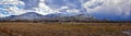 Winter Panorama of Oquirrh Mountain range snow capped, which includes The Bingham Canyon Mine or Kennecott Copper Mine, rumored th