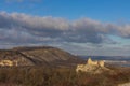 Winter panorama of Palava with Sirotci hradek ruins. Devin hill with transmitter and Devicky castle in background under a dramatic Royalty Free Stock Photo
