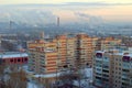 Winter panorama of residential areas of the city of Togliatti and smoking chimneys of chemical plants.