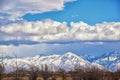 Winter Panoramic view of Snow capped Wasatch Front Rocky Mountains, Great Salt Lake Valley and Cloudscape. Utah Royalty Free Stock Photo