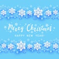 Christmas greeting card with paper snowflakes border on blue background for Your holiday design Royalty Free Stock Photo