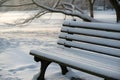 Winter Park Scene Ã¢â¬\' Snow-Covered Bench and Trees in Peaceful Outdoor Setting Royalty Free Stock Photo