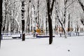 Winter park square with children s playground, covered with snow. Children`s slides and swings in winter. Dnipro, Dnipropetrovsk, Royalty Free Stock Photo