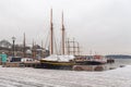 Winter Parking of ships with masts moored to the sea pier Royalty Free Stock Photo