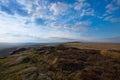 Winter in the Peak District, big sky and brown heather amid the gritstone rocks near Hope Valley Royalty Free Stock Photo