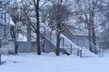 Winter. The pedestrian bridge and the front square are covered with snow. Royalty Free Stock Photo