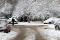 Winter. People walk on a very snowy roads. People step on an snow-stray pathway. Icy sidewalk. Ice on sidewalks