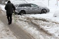 Winter. People walk on a very snowy roads. People step on an snow-stray pathway. Icy sidewalk. Ice on sidewalks