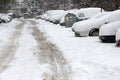 Winter. People walk on a very snowy sidewalk and road. People step on an icy pathway, icy sidewalk. Uncleaned streets and roads Royalty Free Stock Photo