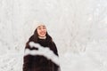 Winter photo shoot of a young woman.wide white-toothed smile, laugh with your eyes closed