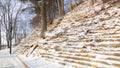 winter picturesque park land landscape designed in city with stone terraces and walking area, December morning tranquility time Royalty Free Stock Photo