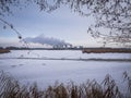 Winter pond landscape with power plant Royalty Free Stock Photo