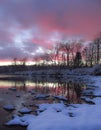 Winter pond sunset and snow