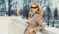 Winter portrait beautiful young blonde woman wearing a coat, sunglasses outdoors Royalty Free Stock Photo