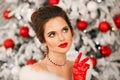 Winter portrait of Elegant woman with ruby jewelry set and red gloves. Beautiful brunette lady with wedding hairstyle, beauty Royalty Free Stock Photo