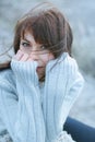 Winter portrait of a girl in sweater. Close up woman freezing outdoor portrait Royalty Free Stock Photo