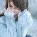 Winter portrait of a girl in sweater. Close up woman freezing outdoor portrait Royalty Free Stock Photo