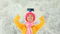 Winter portrait of happy cheerful smiling young woman 20s taking selfie with mobile phone wearing knitted sweater, hat and scarf Royalty Free Stock Photo