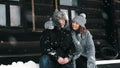 winter portrait. Happy, funny couple in love, man and woman, dressed in warm winter clothes, fully covered with Royalty Free Stock Photo