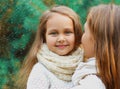 Winter portrait happy smiling mother and little girl child over a christmas tree background Royalty Free Stock Photo