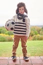 Winter, portrait and kid with soccer ball outdoor ready for playing, sports or exercise and fitness. Boy, game or day Royalty Free Stock Photo