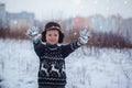 Winter portrait of little kid boy wearing a knitted sweater with Royalty Free Stock Photo