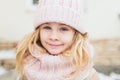 Winter portrait of smile child girl in hat and scarf Royalty Free Stock Photo