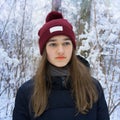 Winter portrait of teen girl in snowy winter forest Royalty Free Stock Photo