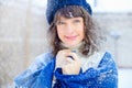 Winter portrait of a young woman. Beauty Joyous Model Girl touching her face skin and laughing, having fun in the winter park. Bea Royalty Free Stock Photo