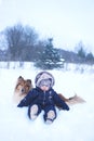 Winter portrtrait of baby and dog Royalty Free Stock Photo