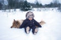 Winter portrtrait of baby and dog Royalty Free Stock Photo