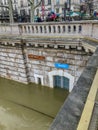 Public toilet door under flood waters on the banks of the Seine, Paris, France