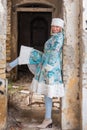 Winter queen in an abandoned castle. A beautiful woman in a winter suit Royalty Free Stock Photo