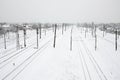 Winter railway landscape, Railway tracks in the snow-covered industrial country Royalty Free Stock Photo