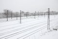 Winter railway landscape, Railway tracks in the snow-covered industrial country Royalty Free Stock Photo