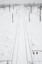Winter railway landscape, Railway tracks in the snow-covered industrial country Royalty Free Stock Photo