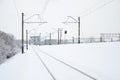 Winter railway landscape, Railway tracks in the snow-covered industrial country Royalty Free Stock Photo