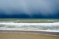 Winter rain storm approaching beach Royalty Free Stock Photo