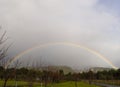 Winter rainbow in the forest and snowy mountains Dirfys on the island of Evia in Greece