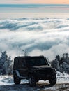 Winter ravel concept with 4x4 car. Offroad winter car. Adventure travel. Off-road travel on snow mountain road.