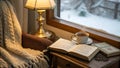 Winter Reading Spot with Hot Tea and Open Book by Snowy Window Royalty Free Stock Photo