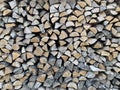 For the winter, ready-made chopped dry firewood. Background from logs, birch, pine and oak. A wall of chopped wood, ready to be Royalty Free Stock Photo