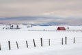 Winter red barn with fence Royalty Free Stock Photo