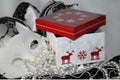 Winter red and white present box giftbox and lacy black and white background Royalty Free Stock Photo