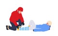 Winter rescuer man bandaging skier victim broken leg to fix injured bone and immobilizing limb Royalty Free Stock Photo