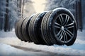 Winter resilience four black tires endure snowfall with steadfast grace Royalty Free Stock Photo