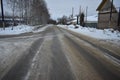 Winter road black asphalt grey ice Royalty Free Stock Photo
