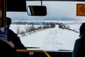 Winter road, bus window view. Winter route of tourist bus_